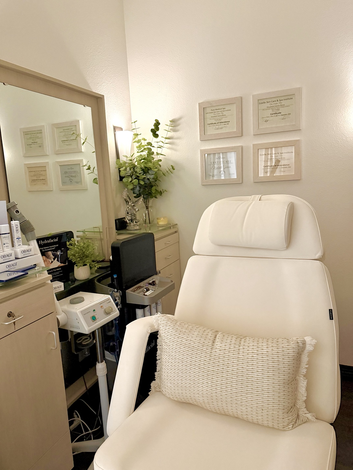Cream treatment chair and warm lighting inside the Ethereal suite